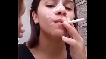 Smoking cigarette with his face full of sperm.